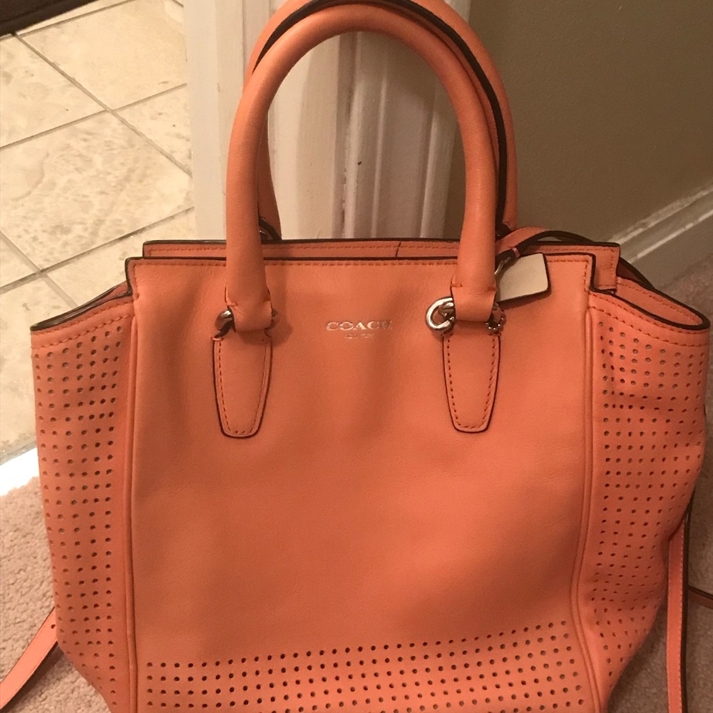 Small Coach handbag-with crossbody strap.